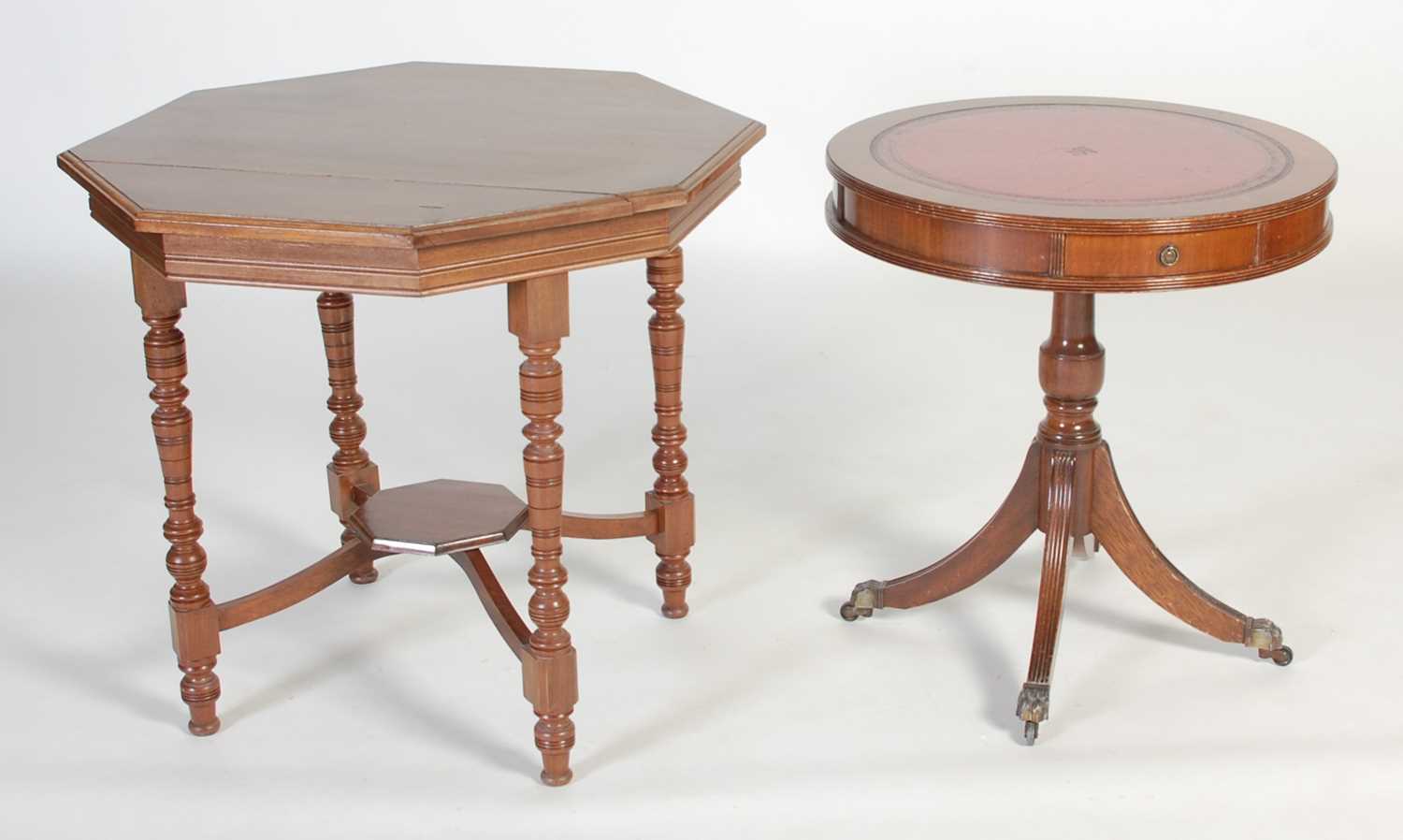 Lot 24 - A reproduction mahogany drum shaped occasional...