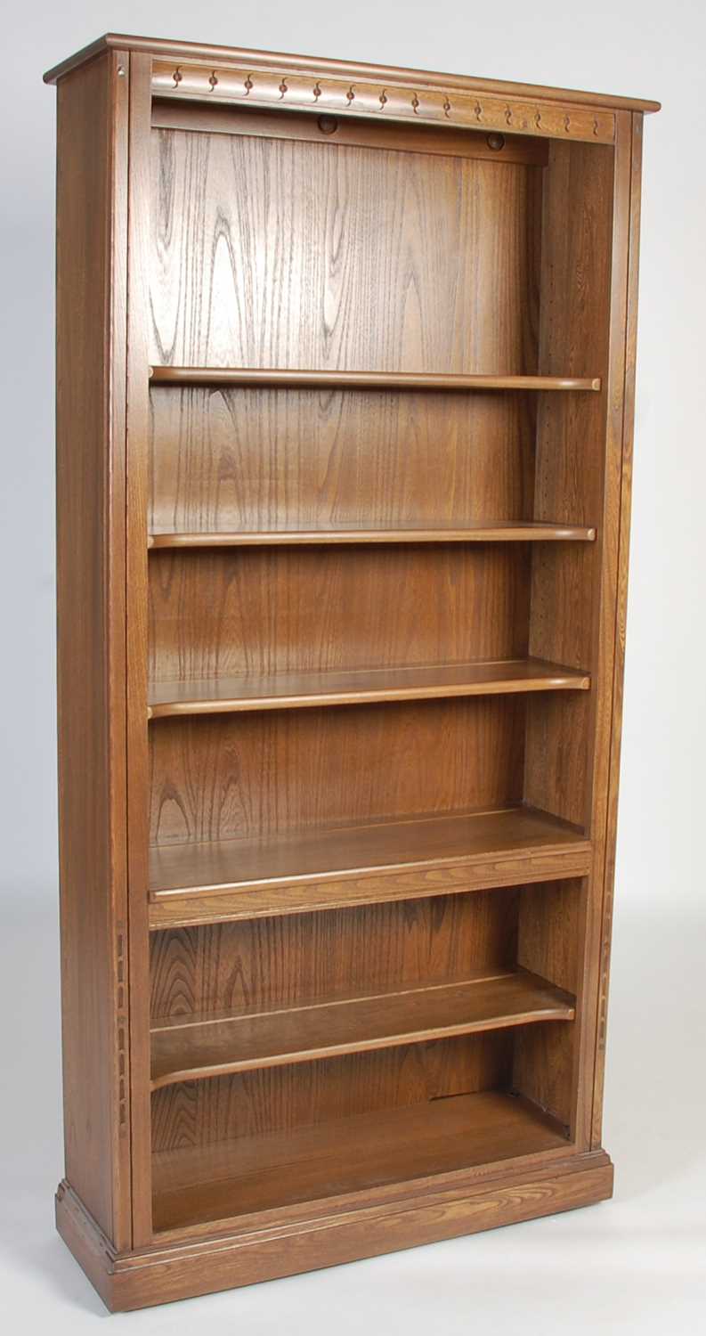 Lot 63 - An Ercol open bookcase, fitted with four...