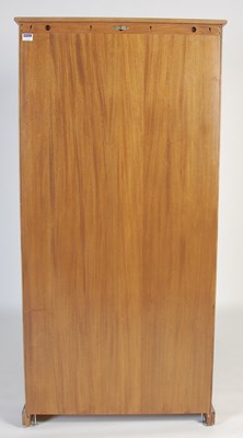 Lot 63 - An Ercol open bookcase, fitted with four...