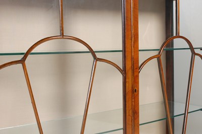 Lot 50 - An early 20th century walnut bowfront display...