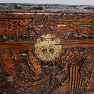 Lot 34 - A Chinese camphorwood blanket box, carved in...