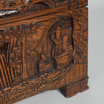 Lot 34 - A Chinese camphorwood blanket box, carved in...
