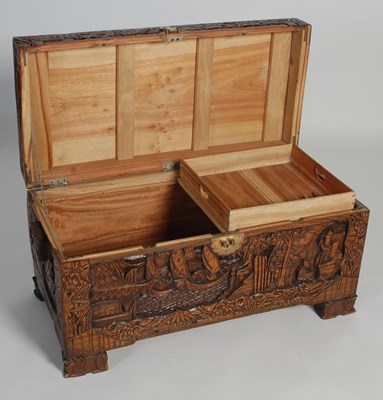 Lot 34 - A Chinese camphorwood blanket box, carved in...