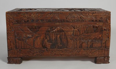 Lot 34 - A Chinese camphorwood blanket box, carved in...