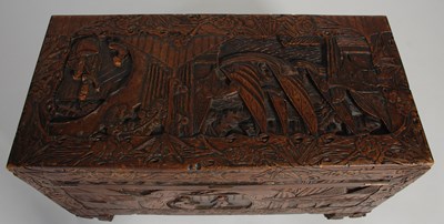 Lot 34 - A Chinese camphorwood blanket box, carved in...