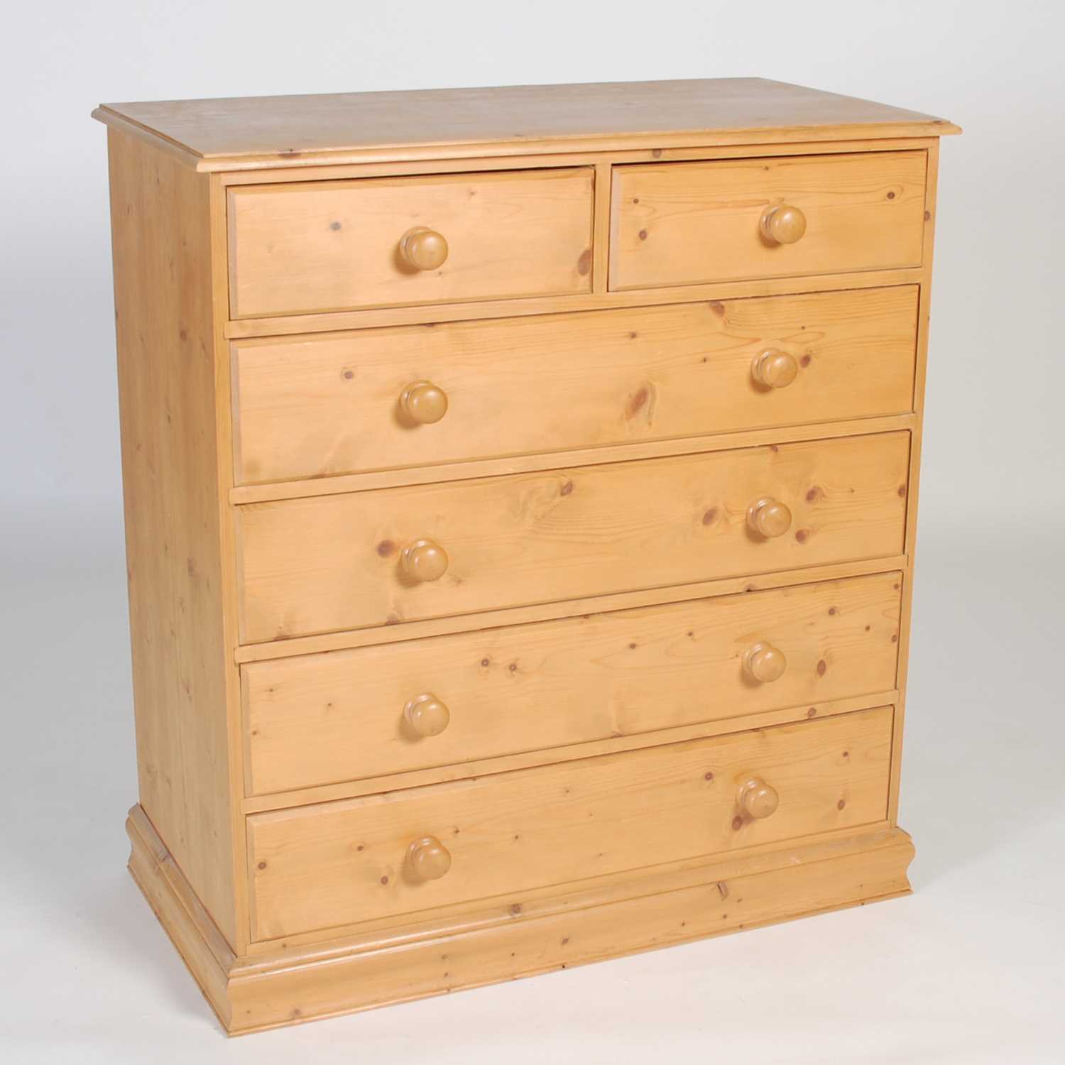 Lot 4 - A pine chest, fitted with two short over four...