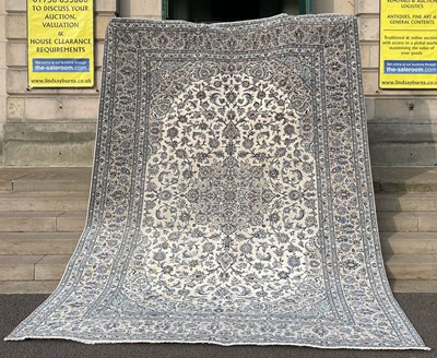 Lot 165 - A Persian Kashan carpet, the rectangular ivory...