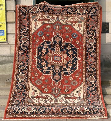Lot 166 - A Persian Heriz carpet, late 19th/ early 20th...