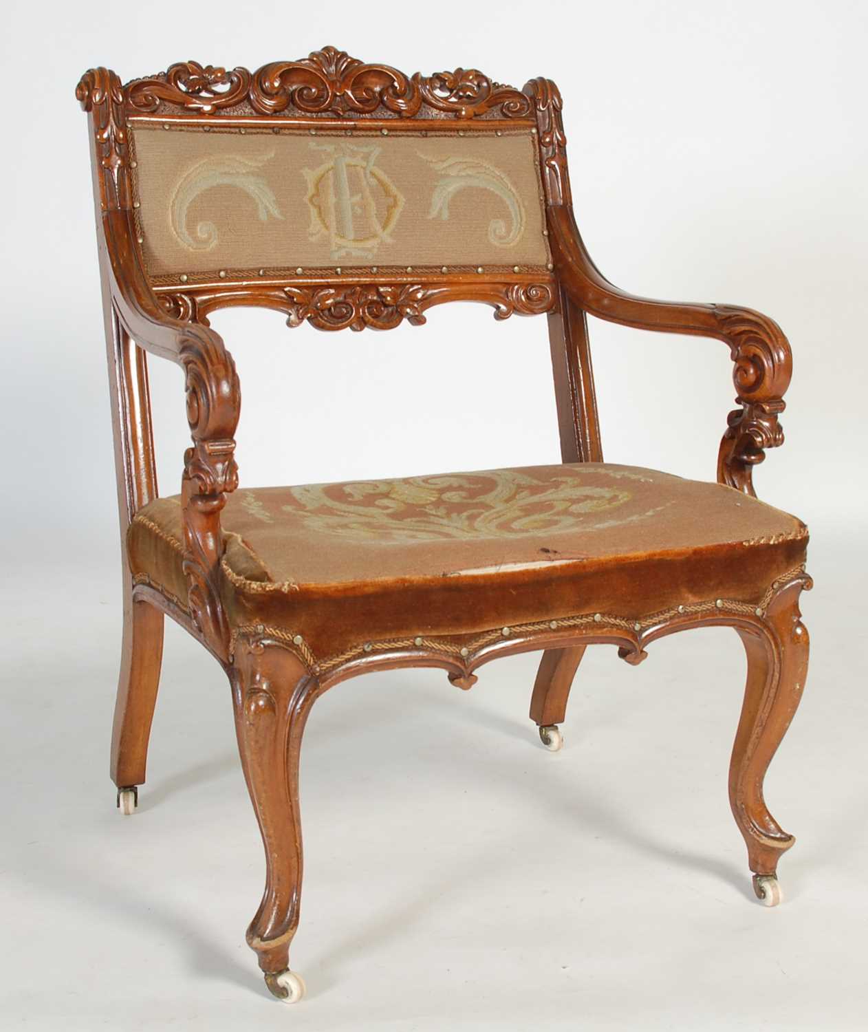 Lot 51 - A Victorian walnut armchair, with needlework...