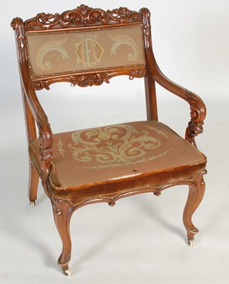 Lot 51 - A Victorian walnut armchair, with needlework...