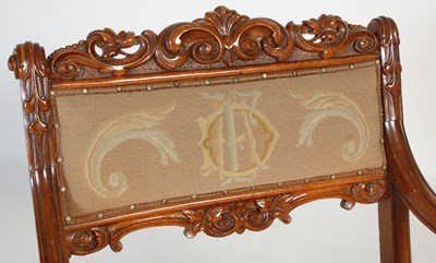 Lot 51 - A Victorian walnut armchair, with needlework...