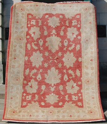 Lot 173 - An Afghan Zeigler rug, the rectangular red...