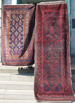 Lot 159 - A Persian runner, the rectangular blue ground...