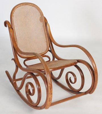 Lot 97 - A Bentwood rocking chair, with canework back...