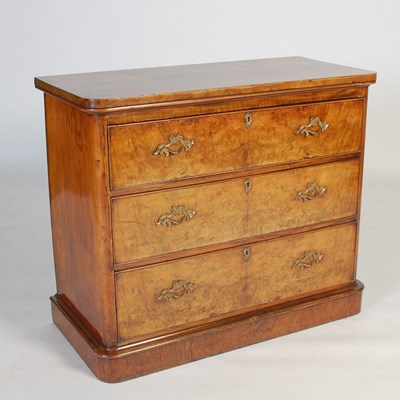 Lot 100 - A late 19th century walnut chest, the rounded...
