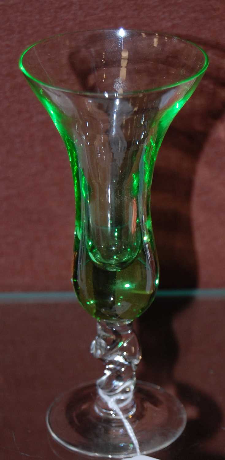Lot 10 - A green and clear liqueur glass with twisted...