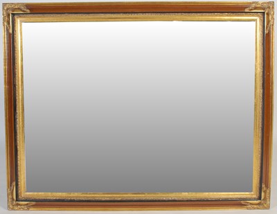 Lot 150 - A gilt framed rectangular bevelled wall mirror,...