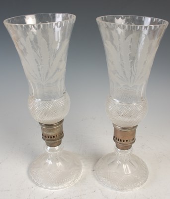 Lot 716 - A pair of glass hurricane lamps, probably...
