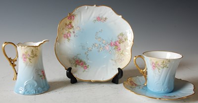 Lot 805 - A Limoges blue ground part tea set.