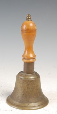 Lot 211 - A handbell with turned wooden handle, 19cm high.