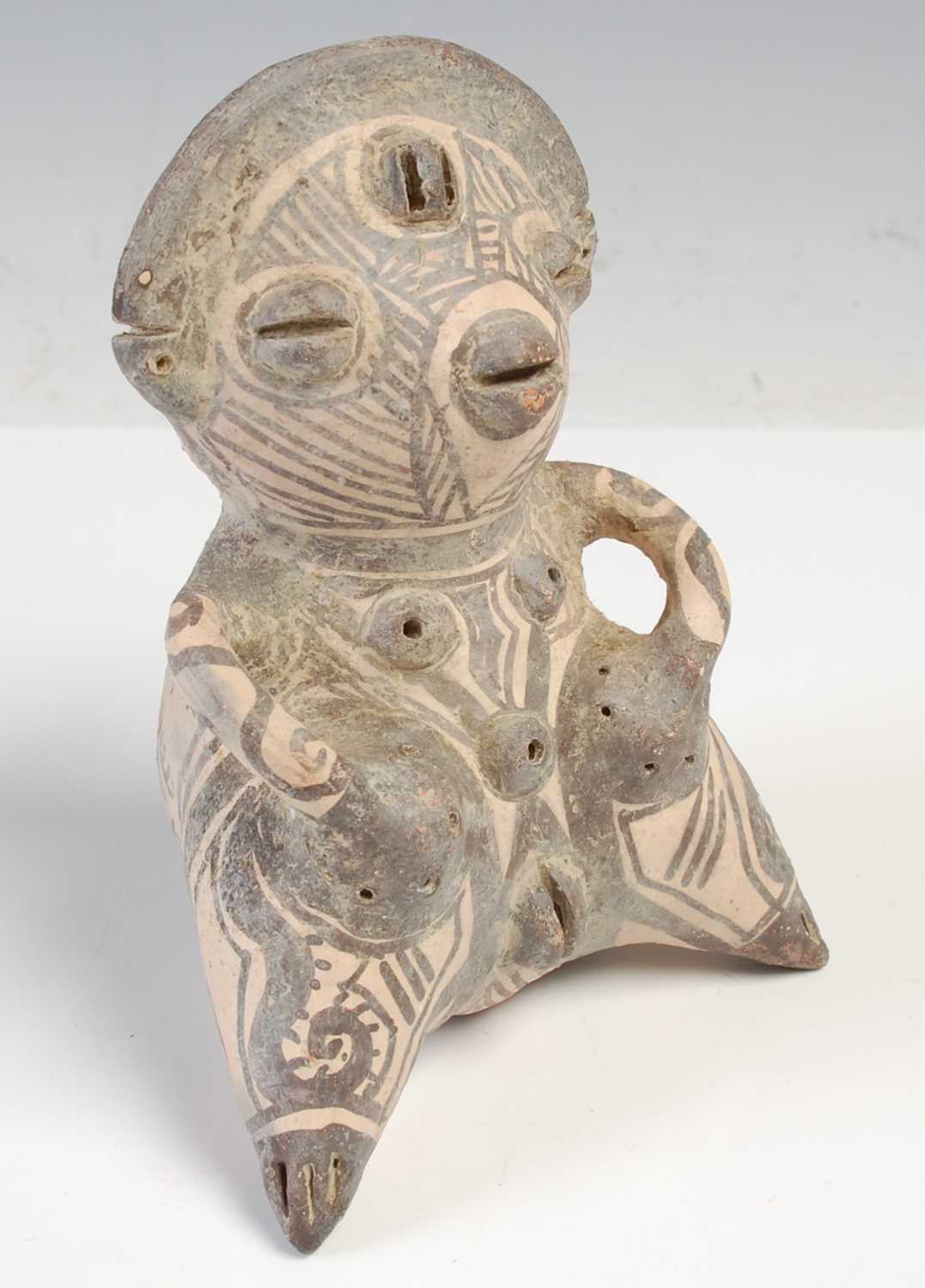 Lot 240 - A South American pottery fertility figure,...