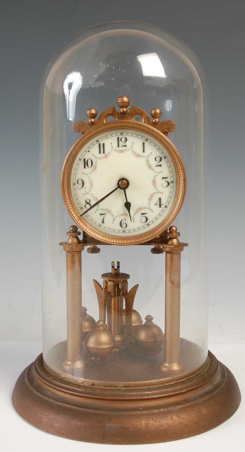 Lot 288 - A vintage mantle clock under glass dome, the...