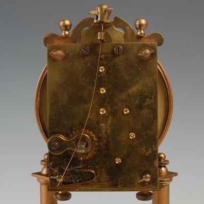 Lot 288 - A vintage mantle clock under glass dome, the...