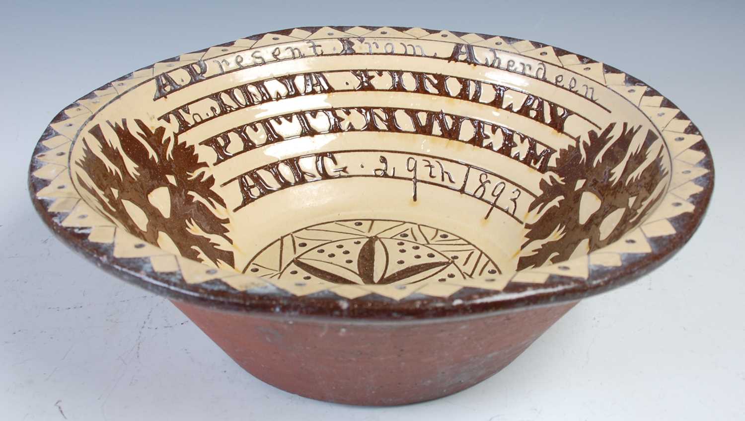 Lot 752 - A Seaton Pottery marriage bowl dated 1893,...