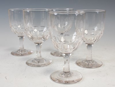 Lot 710 - A set of five 19th century clear glass goblets,...
