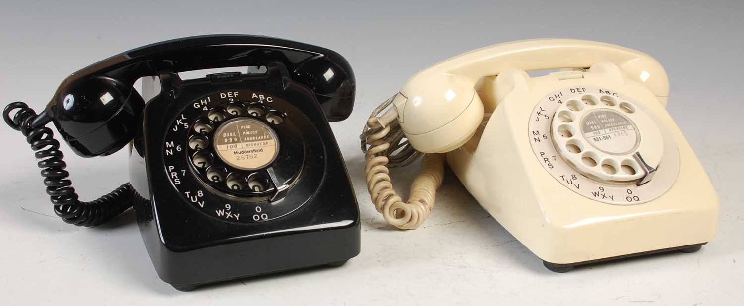 Lot 233 - Two vintage rotary dial telephones, the black...