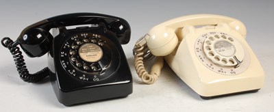 Lot 233 - Two vintage rotary dial telephones, the black...