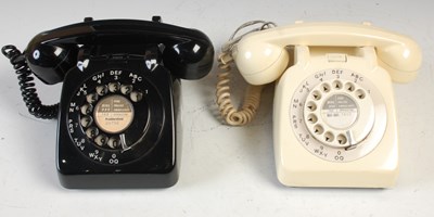 Lot 233 - Two vintage rotary dial telephones, the black...