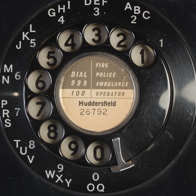 Lot 233 - Two vintage rotary dial telephones, the black...