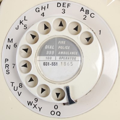 Lot 233 - Two vintage rotary dial telephones, the black...