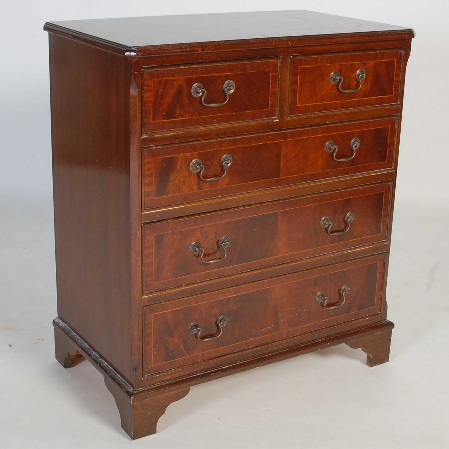 Lot 26 - A reproduction mahogany chest of two short...