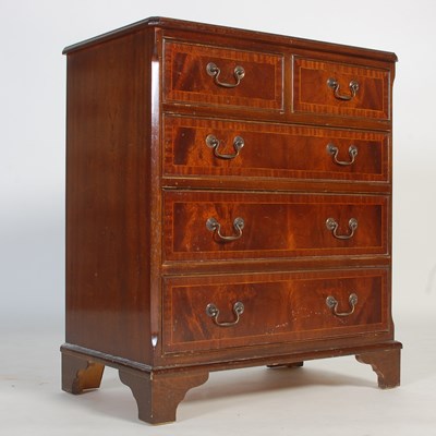 Lot 26 - A reproduction mahogany chest of two short...
