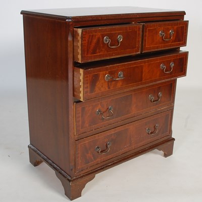 Lot 26 - A reproduction mahogany chest of two short...