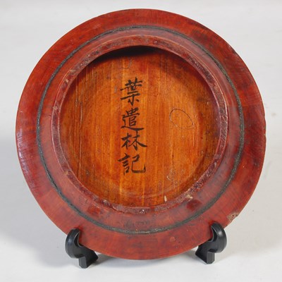 Lot 821 - A Chinese wooden plate holder, containing...