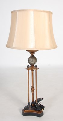 Lot 201 - A decorative table lamp and shade, formed from...