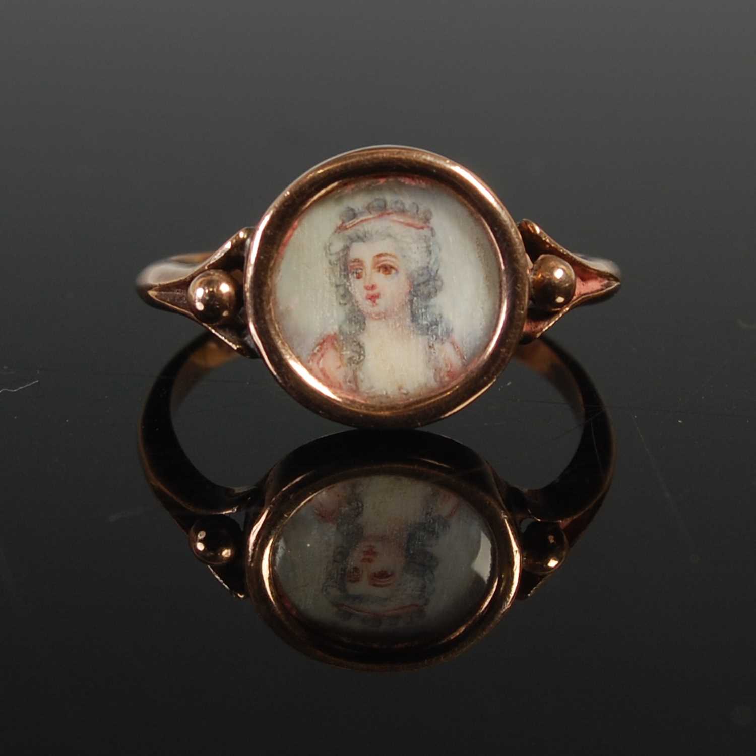 Lot 626 - An 18th century portrait ring, with circular...