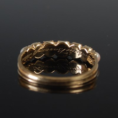 Lot 664 - A 19th century mourning ring, set with seven...