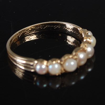 Lot 664 - A 19th century mourning ring, set with seven...