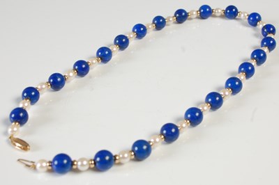 Lot 598 - A lapis lazuli, pearl and gold bead necklace,...