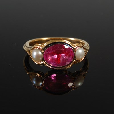 Lot 674 - A dress ring, set with a foiled-back pink...