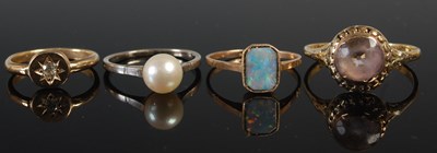 Lot 621 - A group of four various rings, to include a...