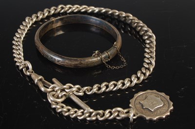 Lot 535 - A silver Albert chain with T-bar suspension...