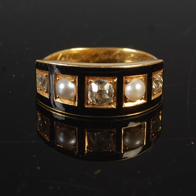 Lot 660 - A 19th century yellow metal, black enamel,...