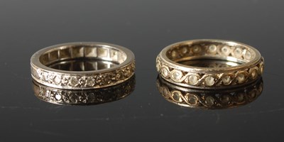 Lot 667 - A white metal and gem set half-hoop eternity...