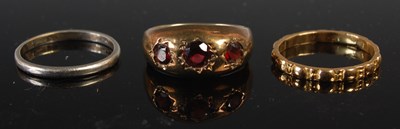 Lot 641 - A yellow metal wedding ring, size P, gross...
