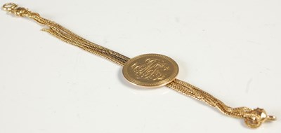 Lot 587 - A yellow metal four row mesh-link...